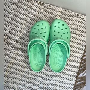 Crocs Unisex-Adult Classic Clogs. Color is pistachio. Size is W10 M8
